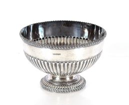 An Edwardian silver rose bowl, having gadrooned border and half fluted body decoration by Harry