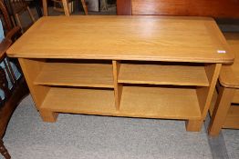 An Ercol television and music stand, 117cm wide x 51cm deep x 58cm high