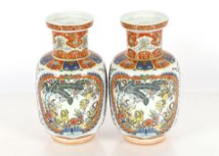 A pair of modern Oriental baluster vases; an oval blue and white metal plate with chicken