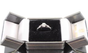 A platinum solitaire diamond ring, the six claw se