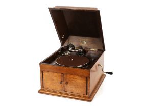 An HMV wind-up table model gramophone, in oak case