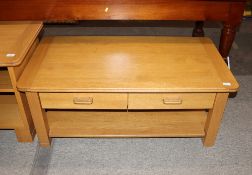 An Ercol coffee table, fitted two drawers and under tier, 110cm wide x 57cm deep x 46cm high
