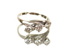 An 18ct white gold three stone diamond ring in unu