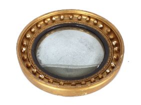 A 19th Century circular gilt convex wall mirror, with ball decoration, 47cm dia.