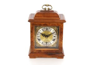 A mid-20th Century walnut cased chiming mantel clock, in the early Georgian style, brass and steel