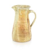 Studio pottery water jug decorated running glazes 29cm high