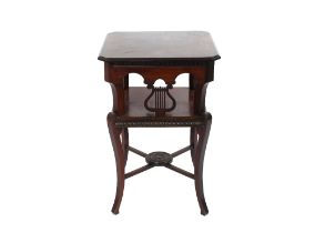 A late 19th / early 20th Century mahogany two tier occasional table, the canted corner top raised on
