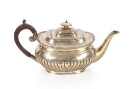 A George V silver teapot, having gadrooned border and half fluted body decoration, London 1925, 21oz