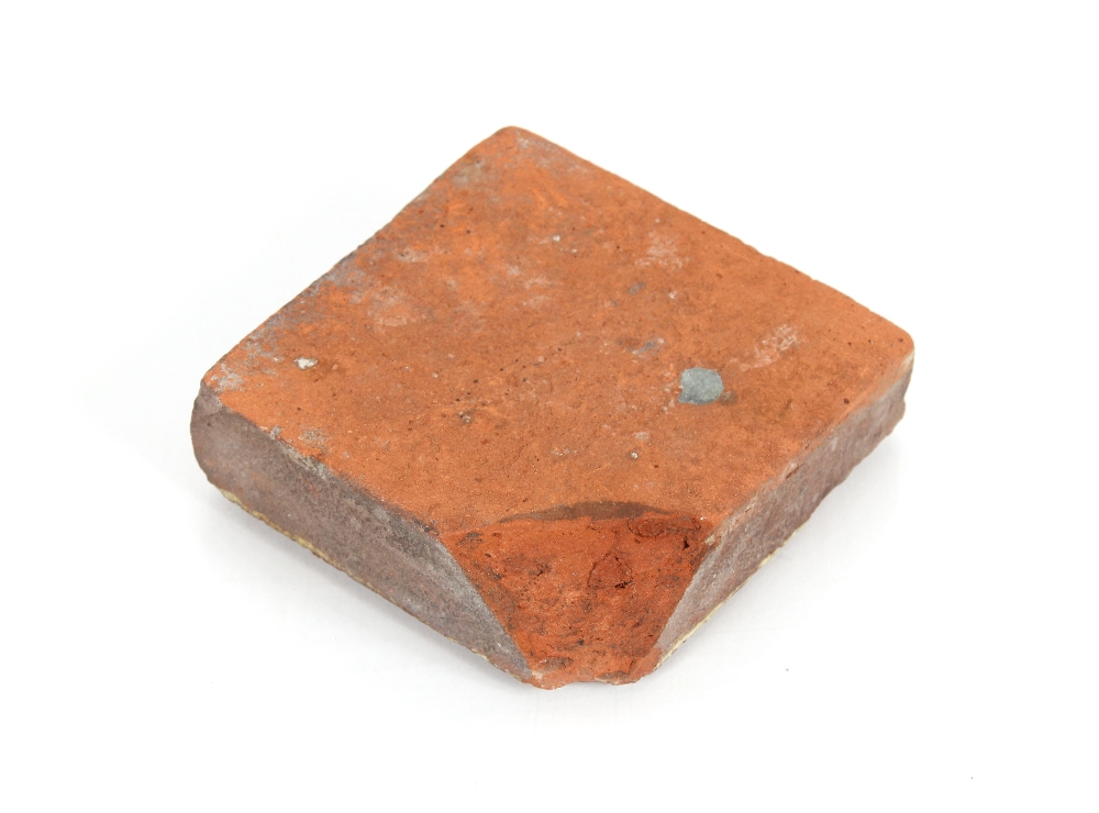 A Medieval period encaustic floor tile with inscription "I.H.S." 11.5cm sq. - Image 2 of 2