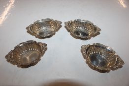 Four Birks Sterling silver pierced dishes, approx.