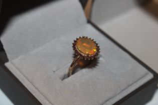 A 9ct gold ring set with coloured stone, ring size