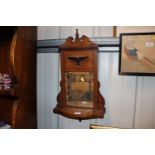 An Edwardian rosewood and inlaid mirrored wall she