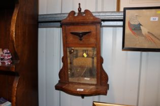 An Edwardian rosewood and inlaid mirrored wall she