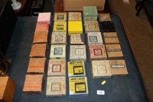 A quantity of boxed Magic Lantern slides to includ