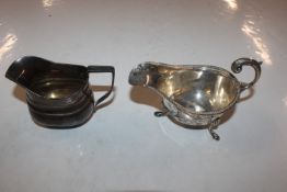A silver sauce boat and silver cream jug approx. t