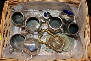 A wicker basket and contents of silver plated ware