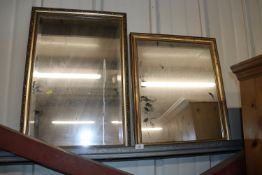 A gilt framed bevel edged wall mirror and a smalle