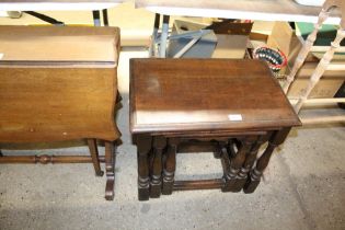 An oak nest of three occasional tables