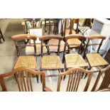 A set of four cane seated dining chairs