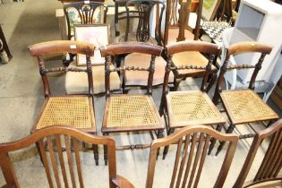 A set of four cane seated dining chairs