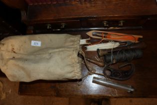 A vintage canvas bag and contents of fishing net mending items etc.
