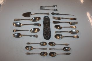 A silver spectacle case; a pair of silver sugar to