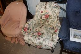 A Victorian Gillows tub shaped easy chair, with floral lin