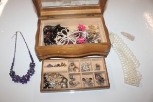 A wooden jewellery box and contents of various cos