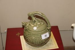 A Chinese celadon glazed Cagodan tea pot with impr