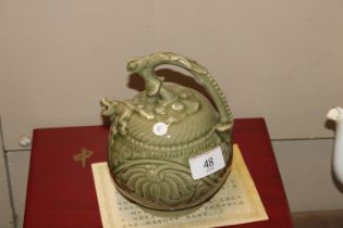 A Chinese celadon glazed Cagodan tea pot with impr