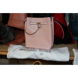 A Michael Kors pink cross body bag