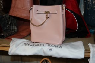 A Michael Kors pink cross body bag