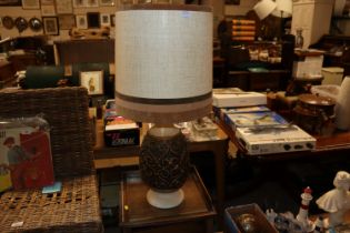 A pottery table lamp and shade