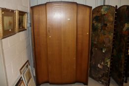 A mid-20th Century single door oak wardrobe