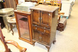 An oak side cabinet fitted brushing slide