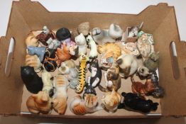 A box of various cat ornaments