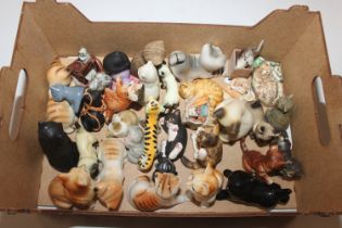 A box of various cat ornaments