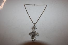 A Victorian solid silver cross with articulated ch
