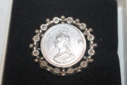 An 1887 Victorian Jubilee silver shilling brooch,