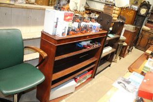 A mahogany open fronted bookcase fitted three adju