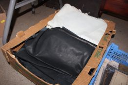 A box of nine leather pelts