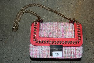 A Carvella multi coloured cross body bag