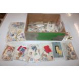 A box of assorted loose stamps