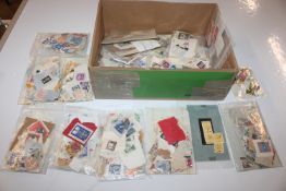 A box of assorted loose stamps