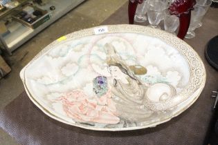 A porcelain dish in the form of a large shell deco