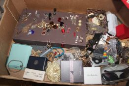 A box containing a large quantity of costume jewel
