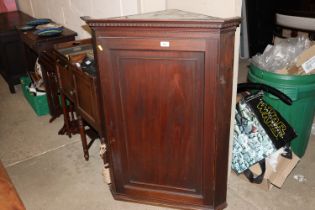 A Georgian mahogany hanging corner cupboard