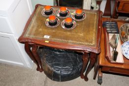 A nest of two leather topped occasional tables; an