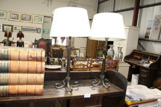 A pair of metal table lamps and shades