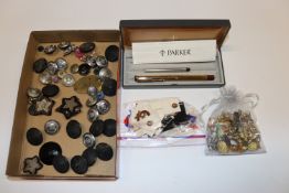 A Parker fountain pen; a collection of stick pins;